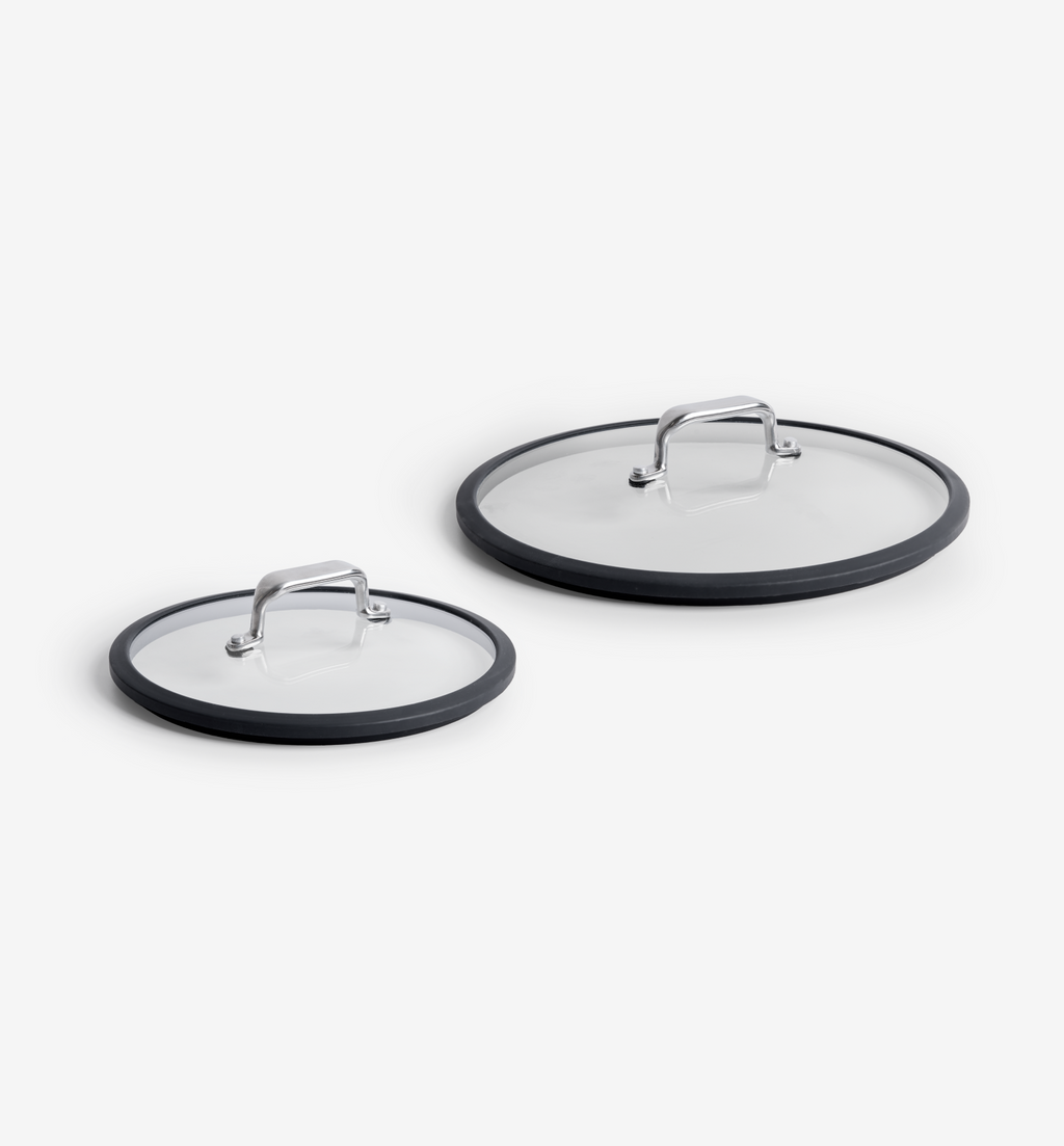 Glass pan lids with silicone rims and stainless steel handles, two sizes